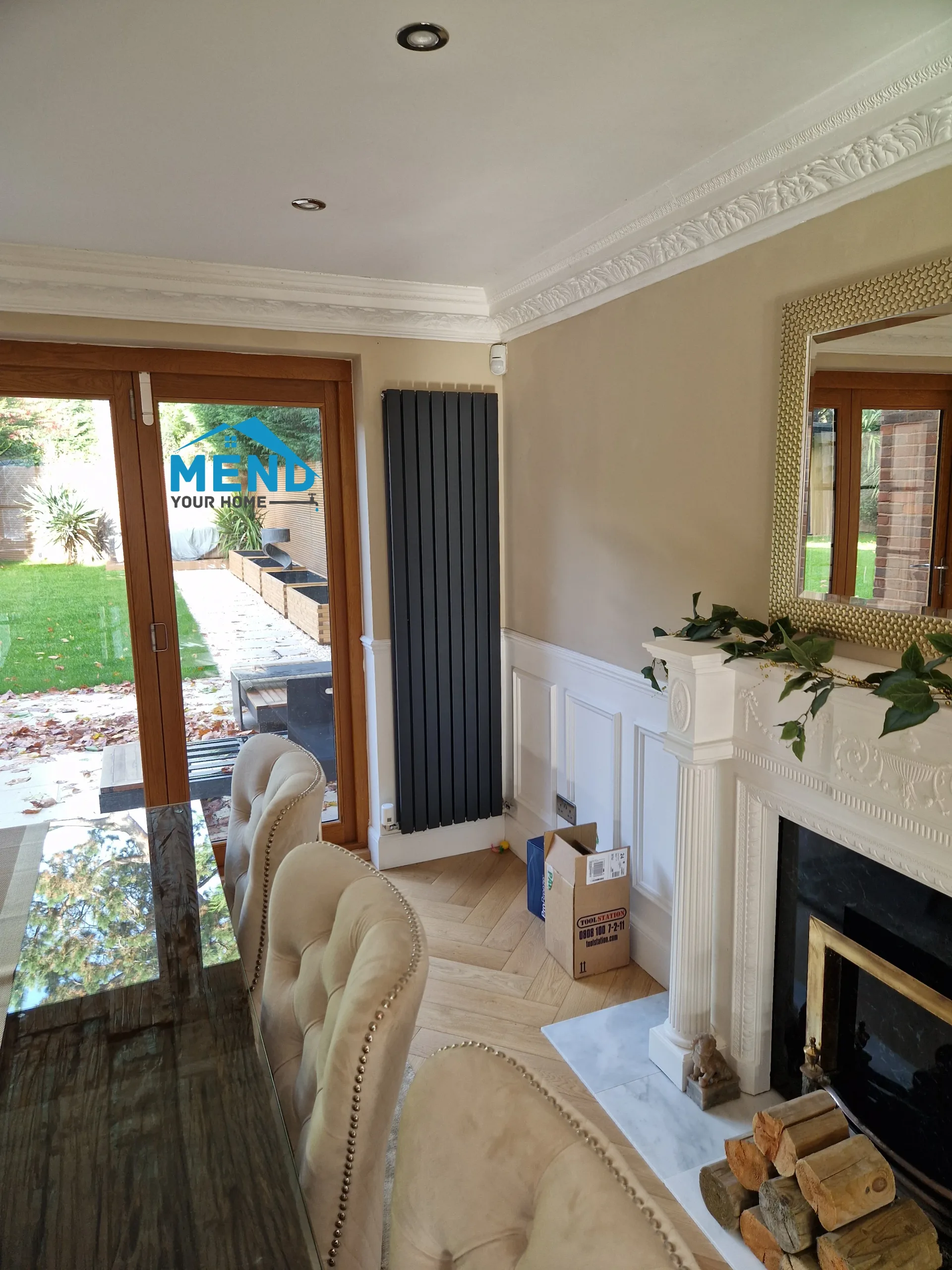 New radiator fitted in a dining room